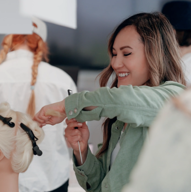 Minh Nguyen styling hair.